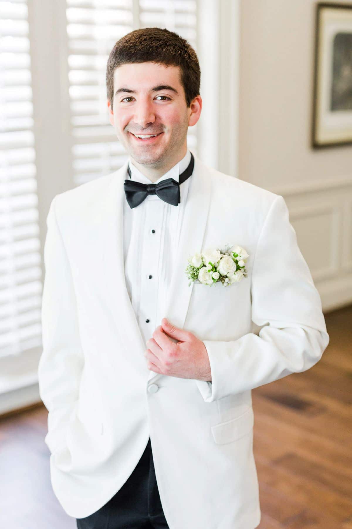 Black Gucci Groomsmen Suits with Bow Ties and Blush Boutonnieres